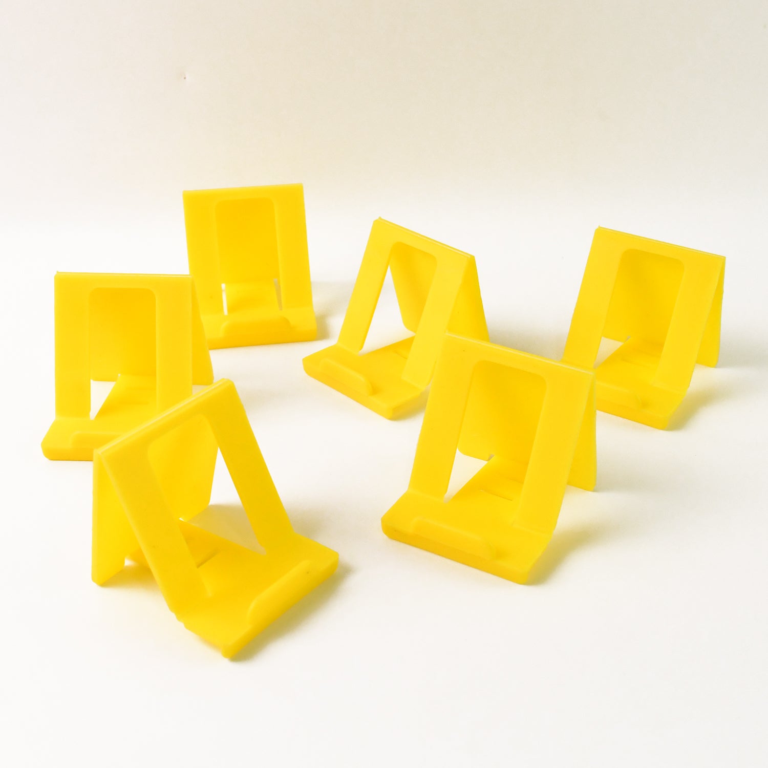 Adjustable Foldable Plastic Mobile Phone Stand (6 Pc  Mix Color) Adjustable Foldable Plastic Mobile Phone Stand (6 Pc  Mix Color)